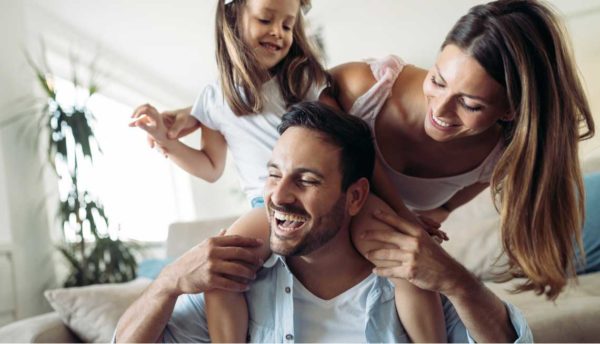 happy family having fun excited about refinancing their home